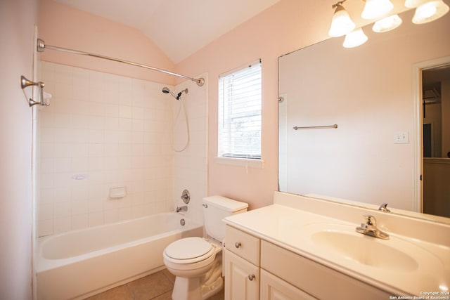 full bathroom with tile patterned floors, lofted ceiling, toilet, vanity, and tiled shower / bath