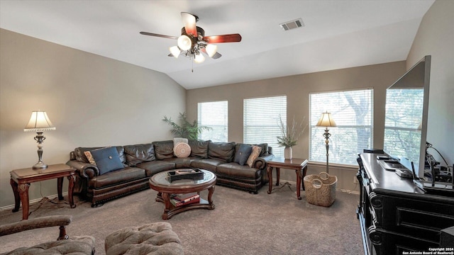 carpeted living room with ceiling fan and lofted ceiling