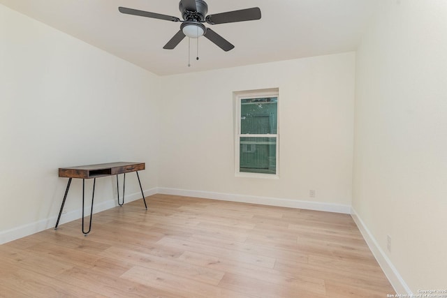 empty room featuring ceiling fan and light hardwood / wood-style flooring