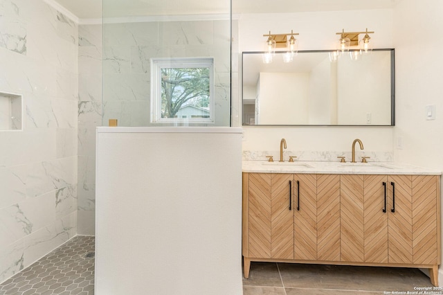 bathroom with vanity, crown molding, and walk in shower