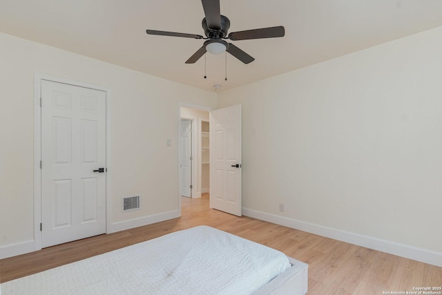 bedroom featuring ceiling fan and light wood-type flooring