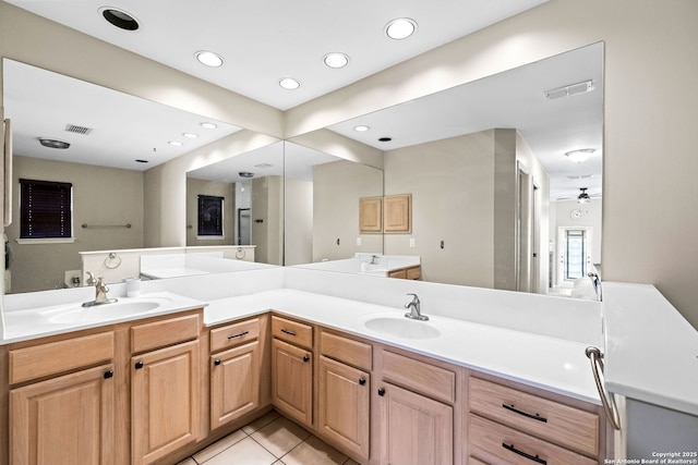 bathroom with tile patterned floors, ceiling fan, and vanity