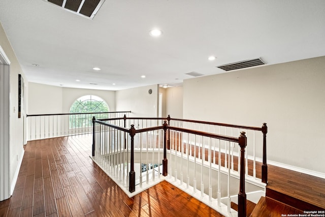 hallway with dark hardwood / wood-style floors