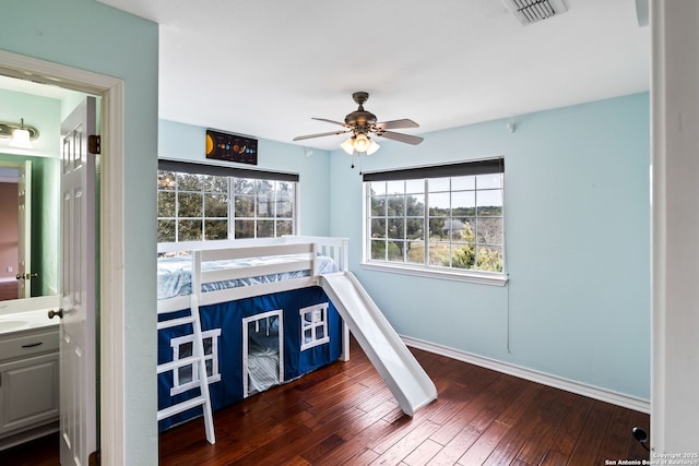 unfurnished bedroom with dark hardwood / wood-style floors and ceiling fan