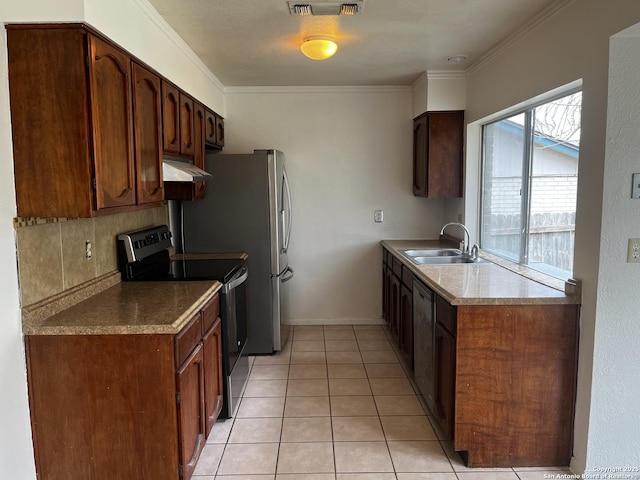 kitchen with sink, stainless steel appliances, backsplash, light tile patterned flooring, and ornamental molding