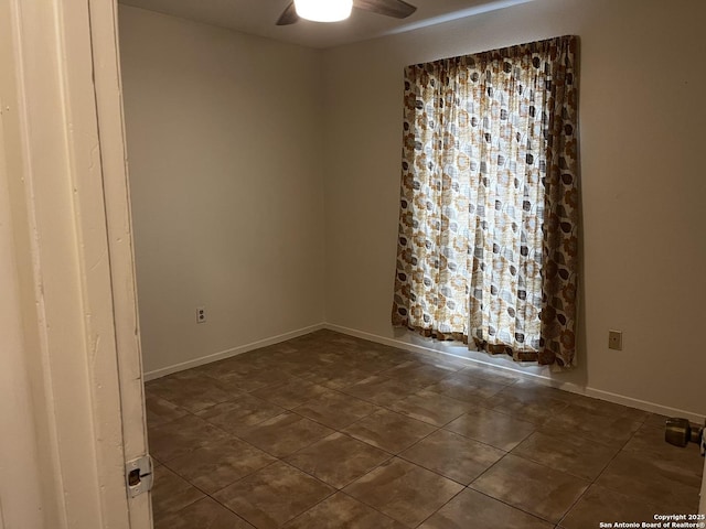 unfurnished room with ceiling fan