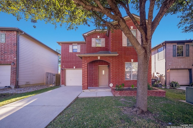 view of front facade with a garage and a front yard