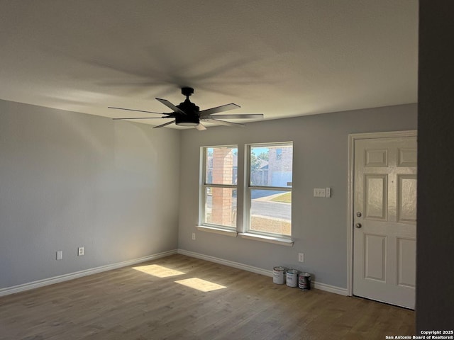 foyer with ceiling fan and light wood-type flooring