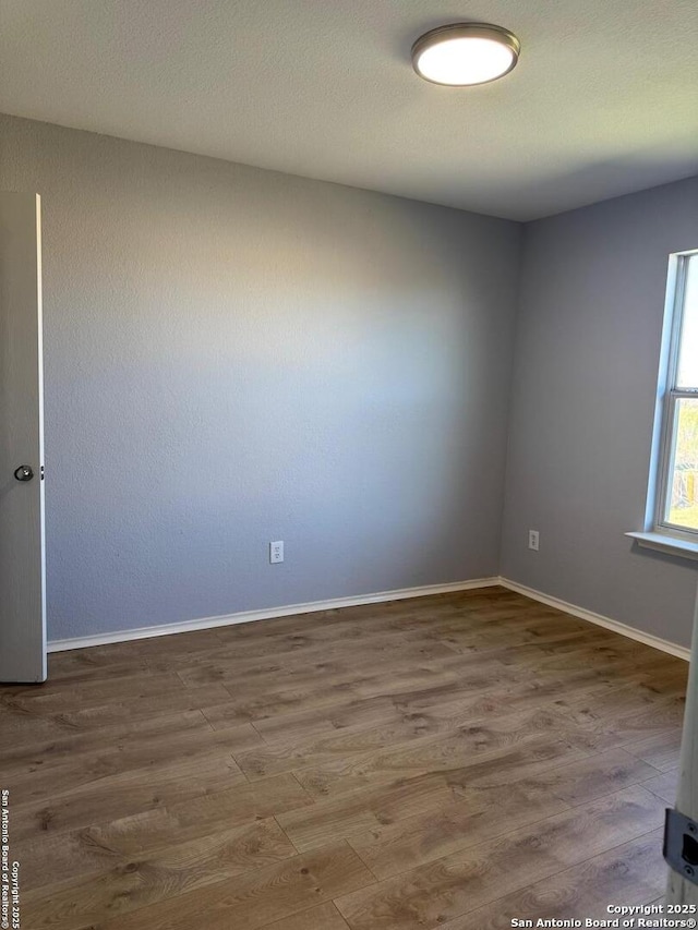 empty room featuring hardwood / wood-style floors