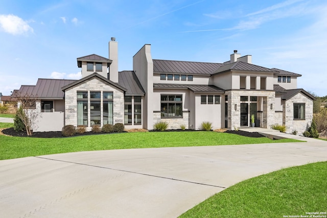 rear view of house with a lawn