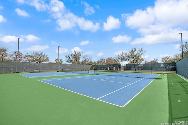 view of tennis court with basketball court