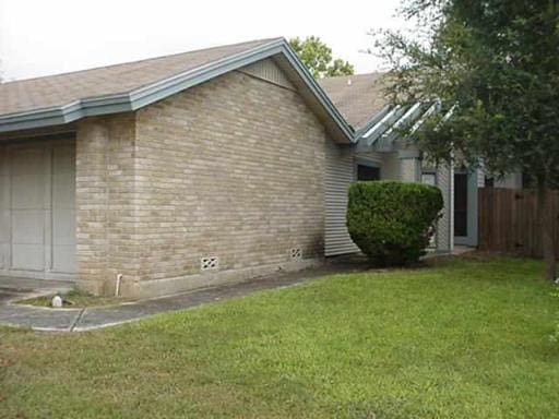 view of home's exterior featuring a yard