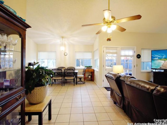 tiled living room with ceiling fan