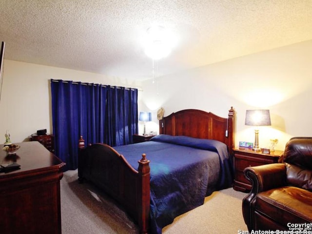 carpeted bedroom with a textured ceiling