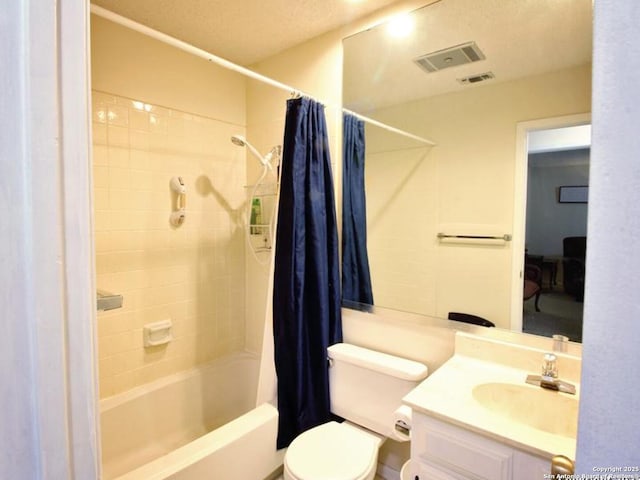 full bathroom featuring shower / tub combo, vanity, and toilet