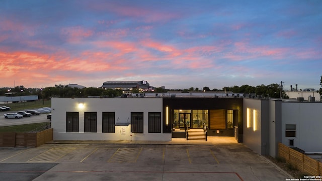 view of back house at dusk