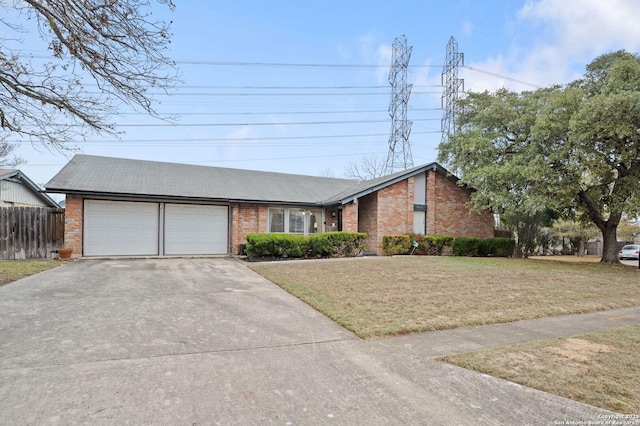 single story home featuring a front lawn and a garage