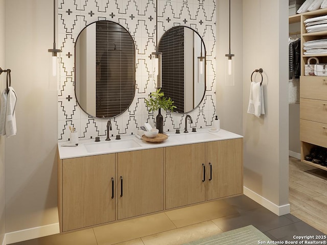 bathroom featuring tile patterned floors, vanity, and backsplash