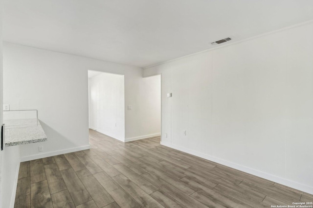 empty room featuring hardwood / wood-style floors