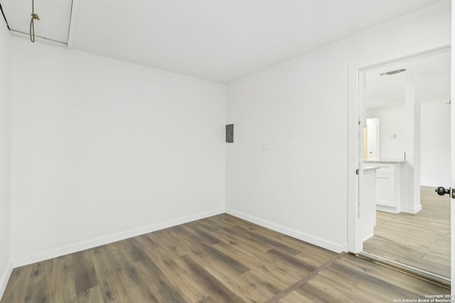 spare room with hardwood / wood-style floors