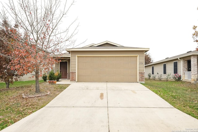 ranch-style home featuring a front yard and a garage