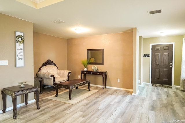 sitting room with light hardwood / wood-style floors