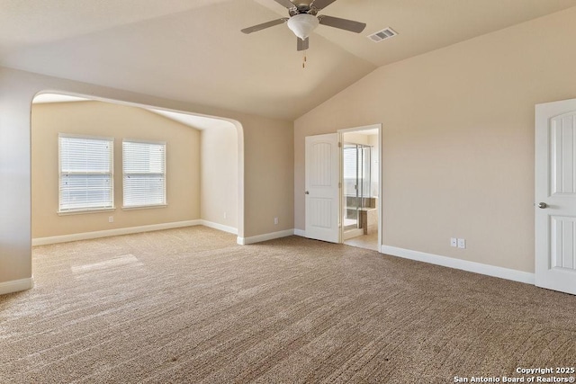 carpeted spare room with vaulted ceiling and ceiling fan