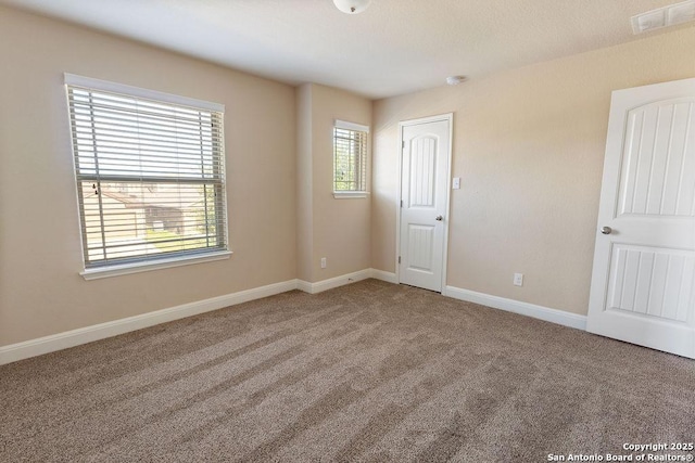 view of carpeted spare room