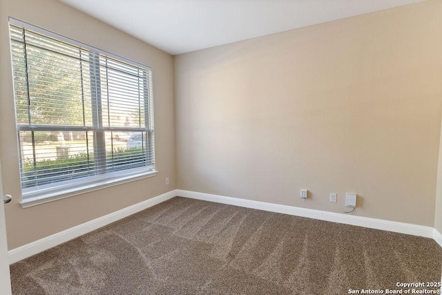 empty room with carpet flooring