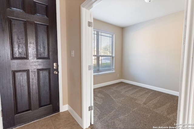 view of carpeted foyer