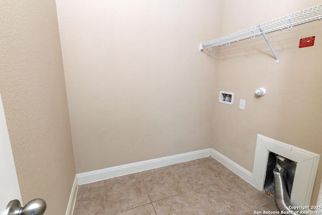 laundry room with washer hookup and light tile patterned floors