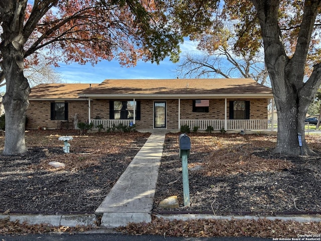 ranch-style home featuring a porch