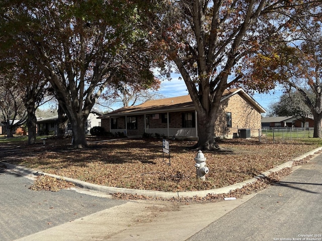 single story home featuring covered porch