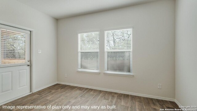 3216 Pemberton Rose, San Antonio, TX 78245 - unfurnished room featuring wood-type flooring