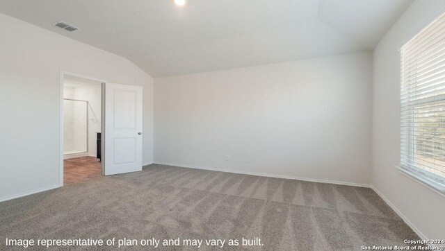3216 Pemberton Rose, San Antonio, TX 78245 - empty room featuring carpet flooring and vaulted ceiling
