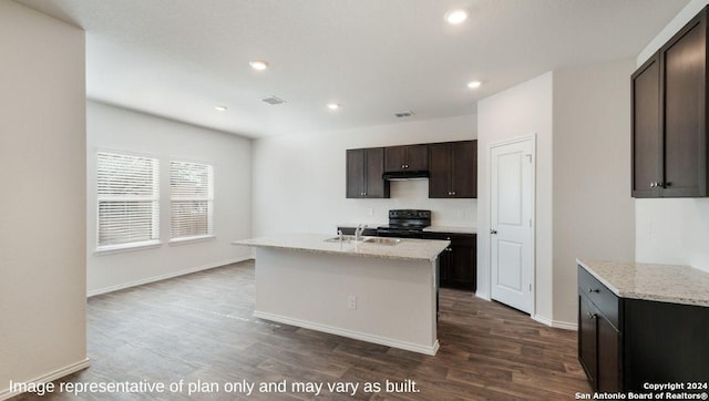 3216 Pemberton Rose, San Antonio, TX 78245 - kitchen with a center island with sink, dark hardwood / wood-style floors, light stone countertops, and black range with electric cooktop
