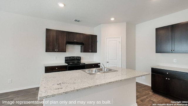 3216 Pemberton Rose, San Antonio, TX 78245 - kitchen featuring dark brown cabinets, sink, a center island with sink, black electric range, and dark hardwood / wood-style floors