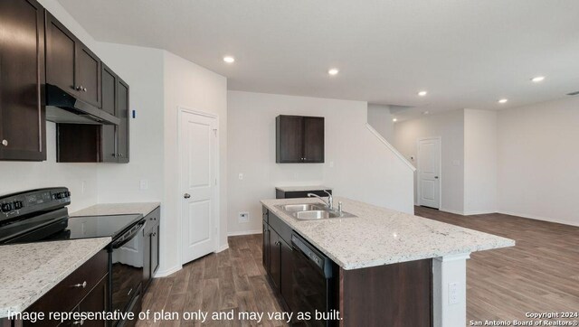 3216 Pemberton Rose, San Antonio, TX 78245 - kitchen with light stone countertops, sink, black appliances, hardwood / wood-style flooring, and an island with sink