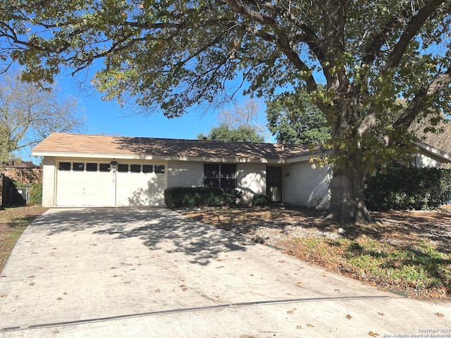 single story home featuring a garage