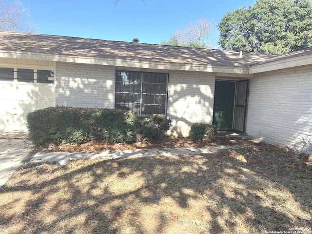 property entrance with a garage