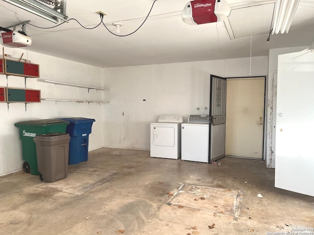 garage featuring washer and clothes dryer and a garage door opener