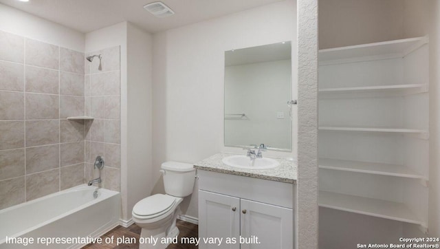 full bathroom featuring toilet, vanity, and tiled shower / bath combo