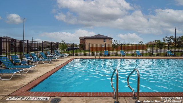 view of pool featuring a patio