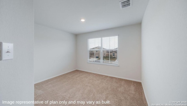 spare room with light colored carpet