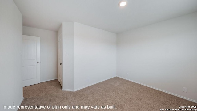 empty room featuring light colored carpet