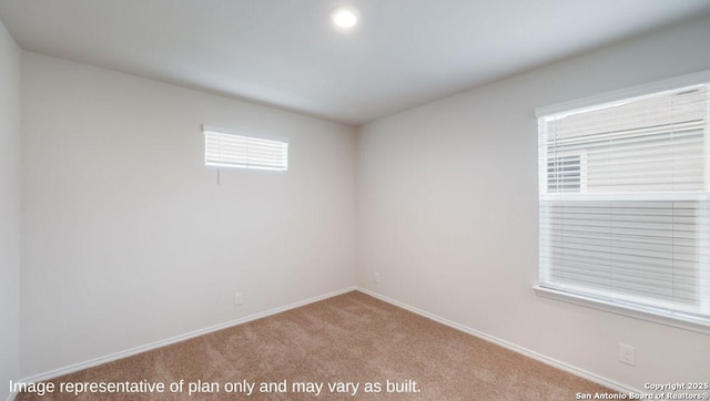 unfurnished room with plenty of natural light and light colored carpet