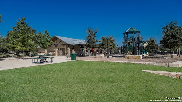 view of jungle gym featuring a lawn