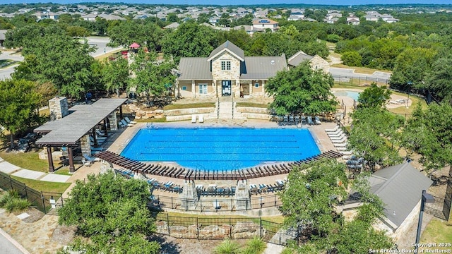 pool featuring fence and a patio