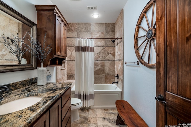 full bathroom with shower / bath combo, vanity, and toilet