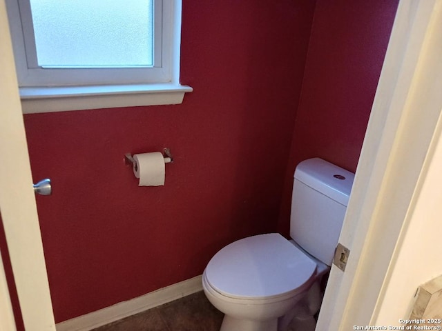 bathroom with tile patterned floors and toilet